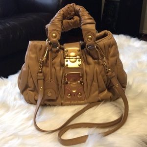 MiuMiu matellasse sling bag